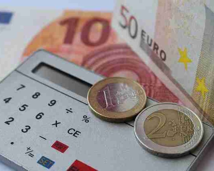 Euro money and calculator for Discounted Cash Flow (DCF).